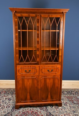 Lot 3047 - A reproduction Regency style yew bookcase,...