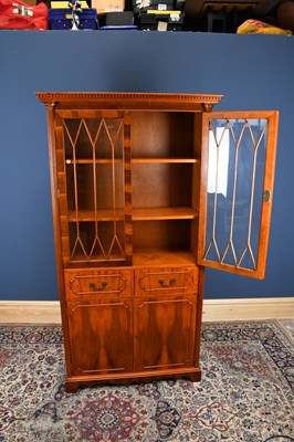 Lot 3047 - A reproduction Regency style yew bookcase,...