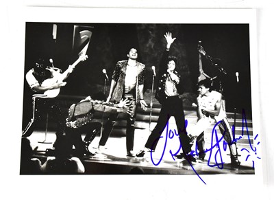 Lot 280 - MICHAEL JACKSON; a black and white photograph...