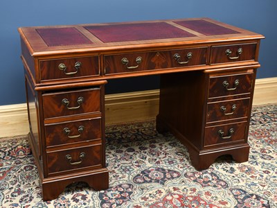 Lot 3041 - A reproduction mahogany pedestal desk, with an...