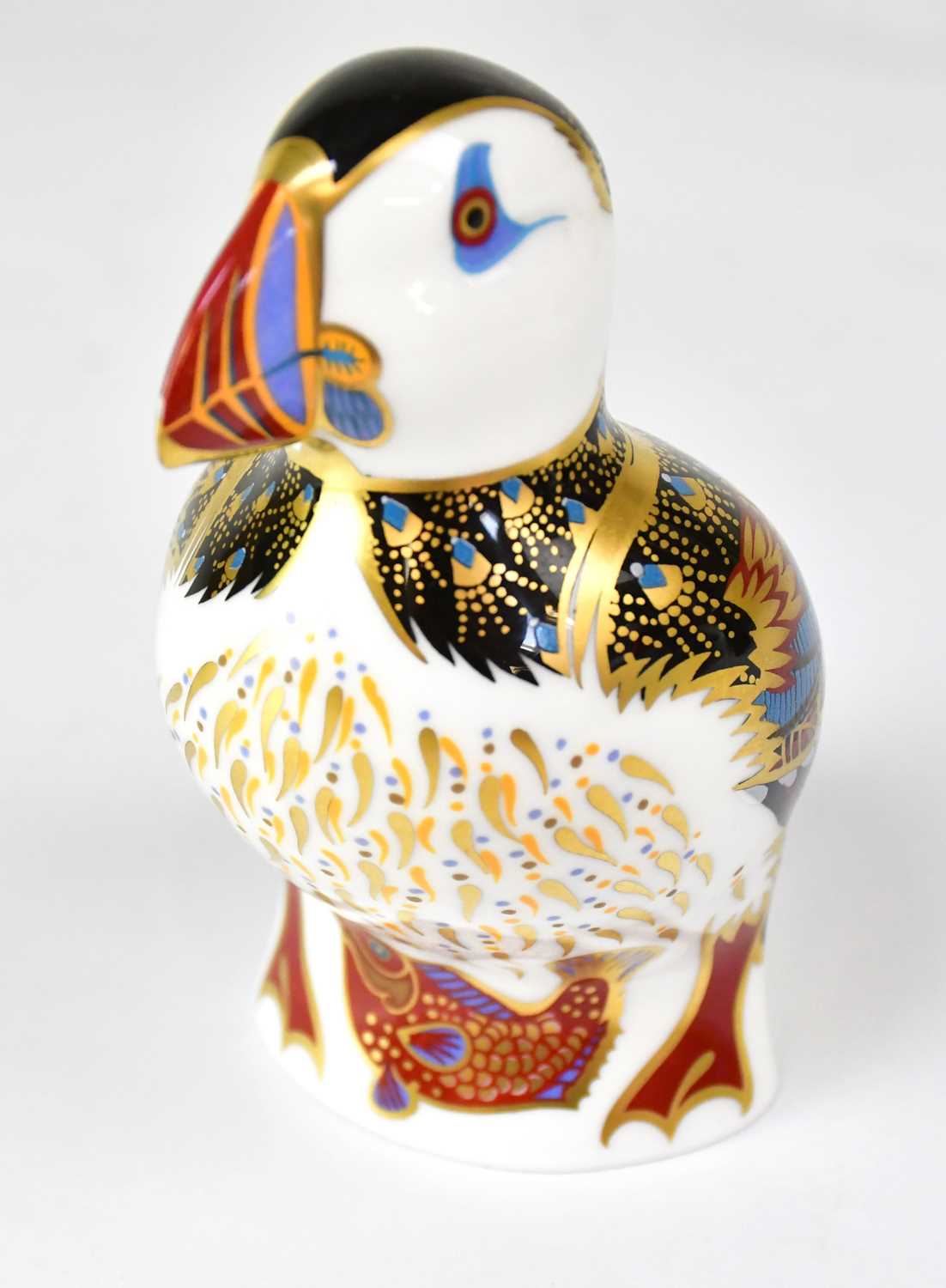 Lot 471 - ROYAL CROWN DERBY; a puffin paperweight with...