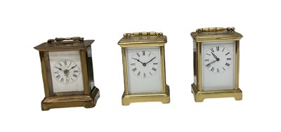 Lot 95 - Three brass cased carriage clocks, all with...