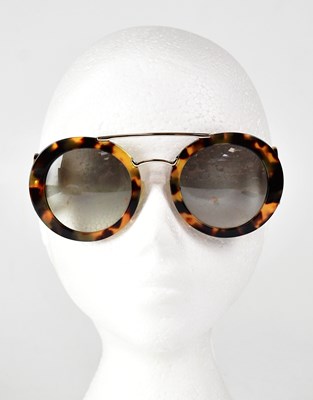 Lot 596 - PRADA; a cased pair of sunglasses.