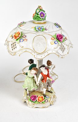 Lot 150 - A Continental porcelain figural table lamp,...