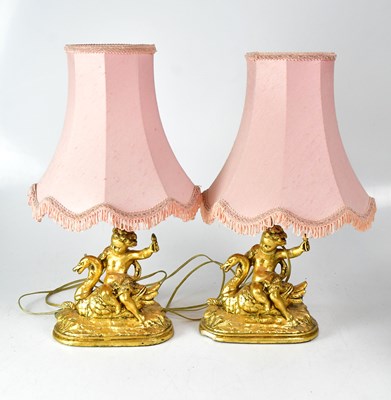 Lot 149 - A pair of table lamps, the gilt painted...