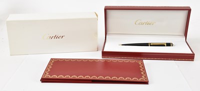 Lot 270 - CARTIER; a cased twist top ballpoint pen.