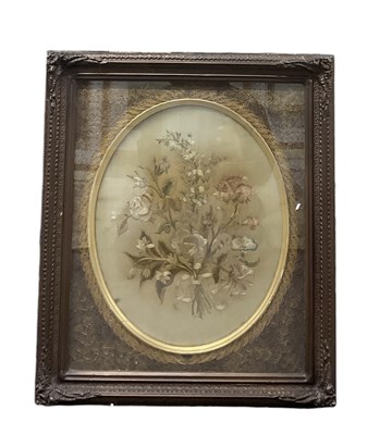 Lot 445 - A George III embroidered oval panel of garden...