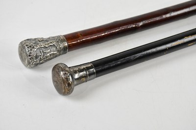 Lot 1281 - A Thai white metal capped walking cane with...