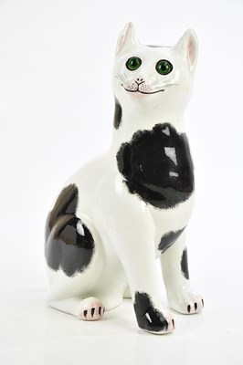 Lot 55 - WEMYSS WARE; a black and white earthenware cat...