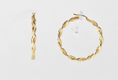 Lot 918 - A pair of 9ct yellow gold barley twist hoop...