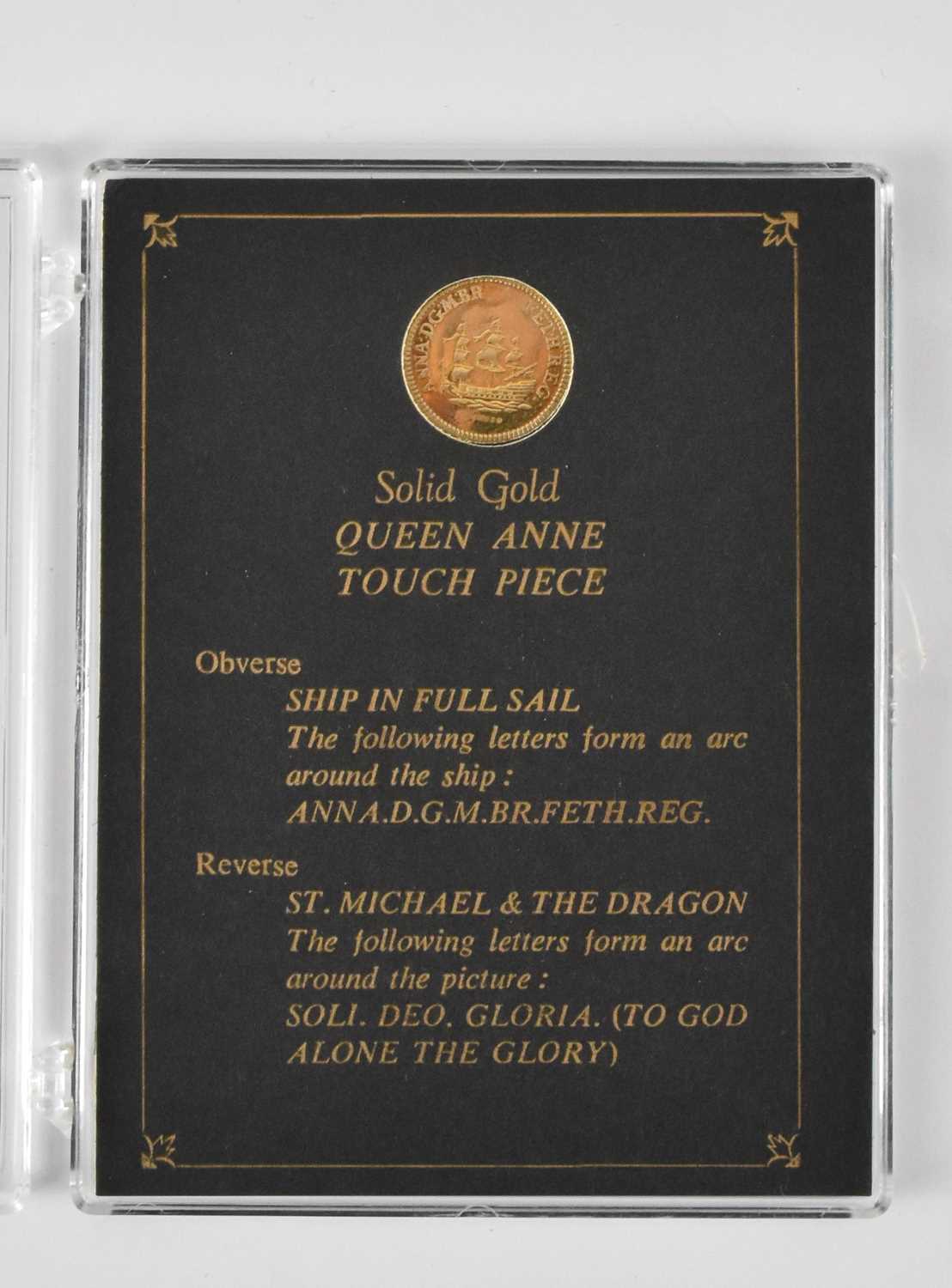 Lot 903 - A 9ct gold replica Queen Anne Touch Piece...