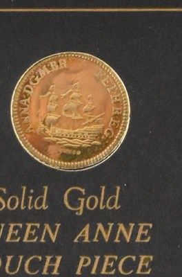 Lot 903 - A 9ct gold replica Queen Anne Touch Piece...