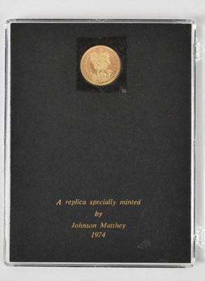 Lot 903 - A 9ct gold replica Queen Anne Touch Piece...