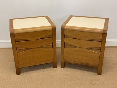 Lot 780 - A pair of light oak bedside tables with three...