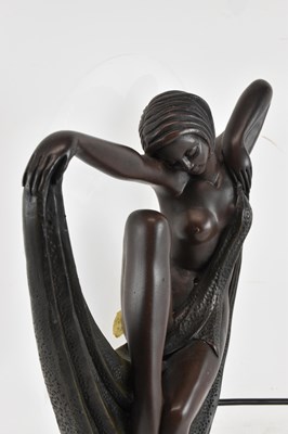 Lot 109 - An Art Deco style bronzed resin figural table...