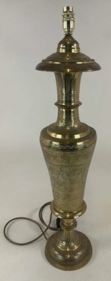 Lot 712 - A large brass table lamp base, etched into...