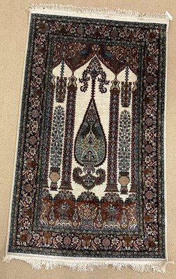 Lot 734 - A small machine woven Persian rug, depicting a...