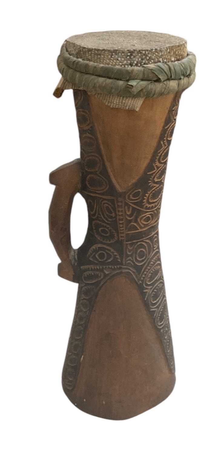 Lot 1055 - A Sepik drum, with carved handle and painted...