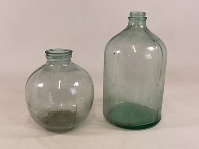 Lot 751 - Two glass carboys, height of the larger 53cm.