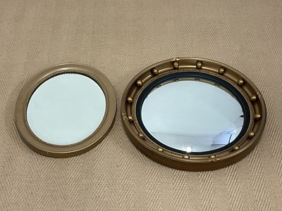 Lot 814 - Two gilt framed wall mirrors, a circular...