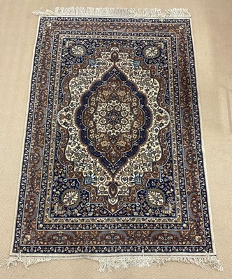 Lot 736 - A machine woven Persian rug, decorated with...