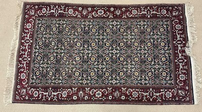 Lot 738 - A machine woven Afghan style rug, mainly...