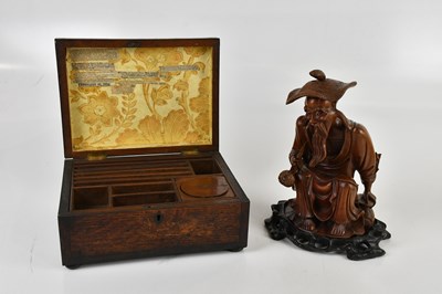 Lot 1152 - A Japanese carved hardwood figure of a sage,...