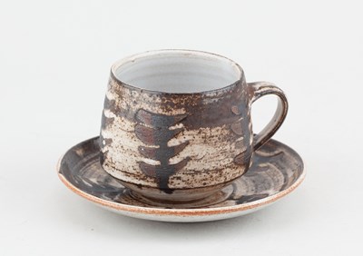 Lot 717 - Briglin Pottery; a tin glazed earthenware cup...