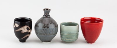 Lot 103 - TIM ANDREWS (born 1960); a raku cup covered in...