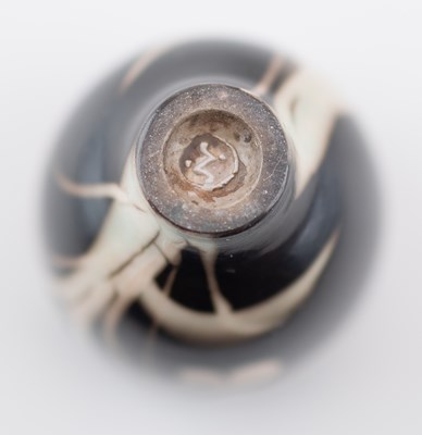 Lot 103 - TIM ANDREWS (born 1960); a raku cup covered in...