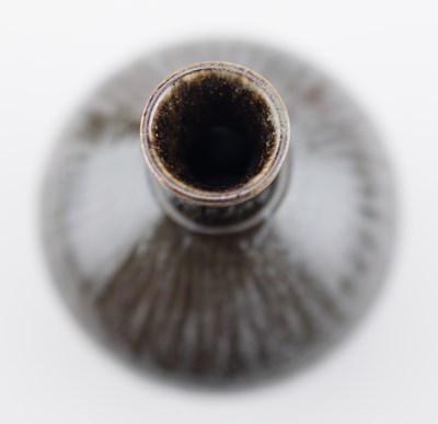 Lot 103 - TIM ANDREWS (born 1960); a raku cup covered in...