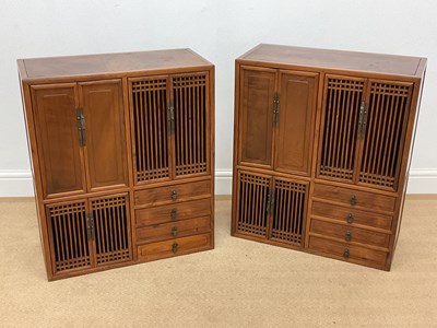 Lot 363 - A pair of Chinese hardwood and elm cabinets,...