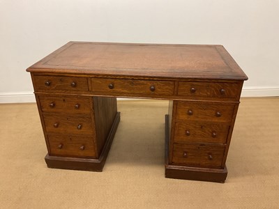 Lot 765 - A late Victorian oak twin pedestal nine drawer...