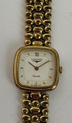 Lot 675 - LONGINES; a lady's gold plated quartz...