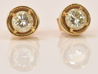 Lot 637 - A pair of 18ct yellow gold diamond ear studs,...