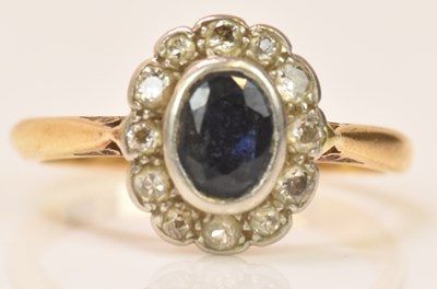 Lot 592 - An 18ct yellow gold sapphire and diamond oval...