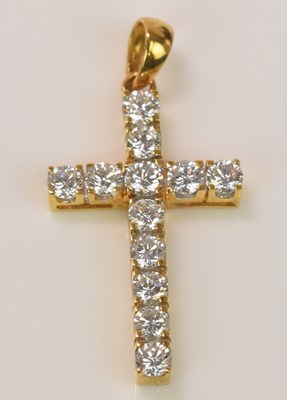 Lot 593 - An 18ct yellow gold diamond set cross, with...