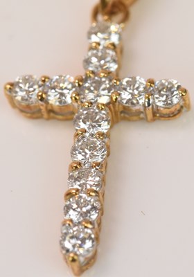 Lot 604 - An 18ct yellow gold and diamond set cross...