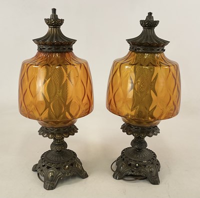 Lot 711 - A large pair of brass and amber coloured glass...