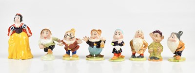 Lot 435 - BESWICK; eight figures, Snow White and the...