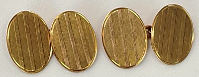 Lot 620 - A pair of 9ct yellow gold cufflinks, each with...