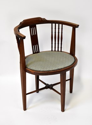 Lot 125 - An Edwardian mahogany bow armchair with turned...