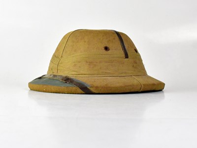 Lot 331 - A Calcutta Sola Hat Agency pith helmet.