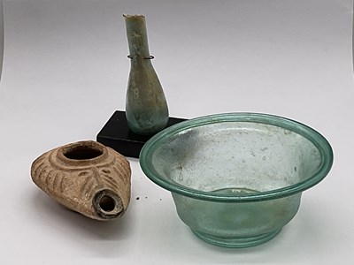 Lot 391 - A Roman 3rd century green tinted glass bowl...