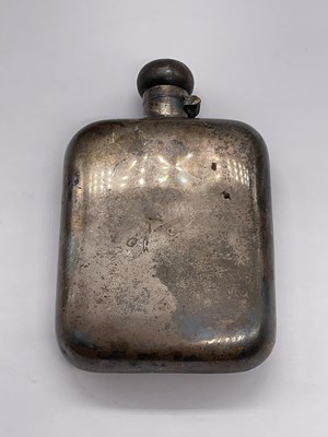 Lot 539 - A George V hallmarked silver hip flask of...