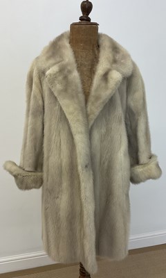 Lot 144 - A cream mink fur coat, three quarter length...