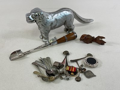 Lot 33 - A large silvered nut cracker in the form of a...