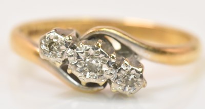 Lot 634 - An 18ct yellow gold platinum tipped three...