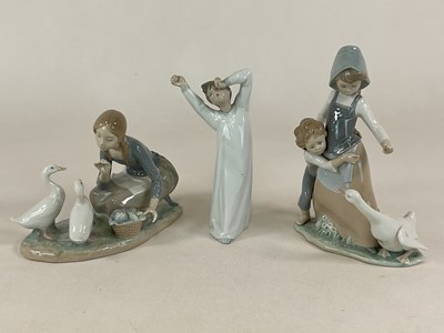 Lot 338 - LLADRO; three figures, two depicting girls...