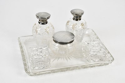 Lot 595 - A cut glass dressing table set, with two...